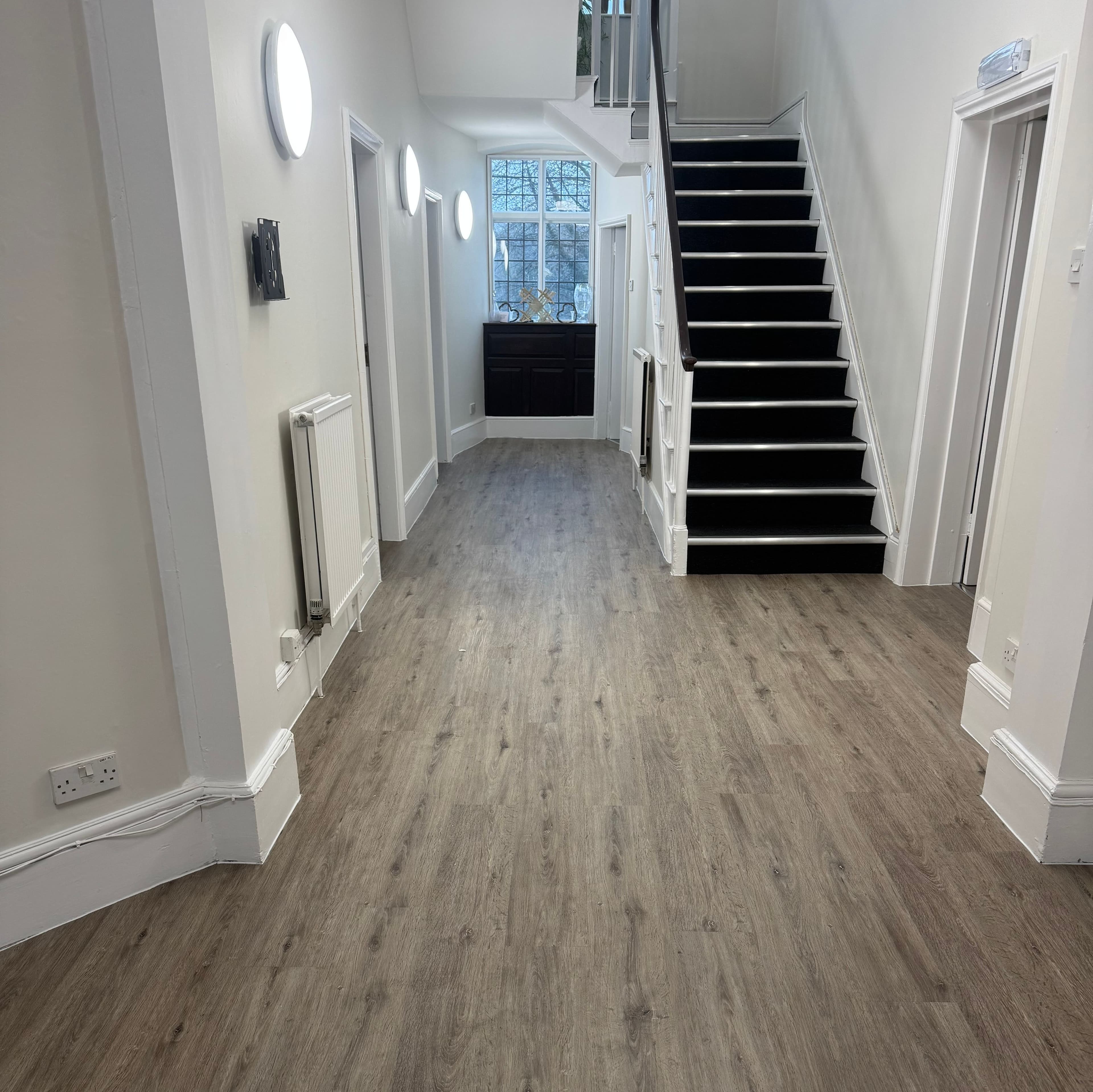 LVT commercial entrance and commercial carpet tiles to stairs